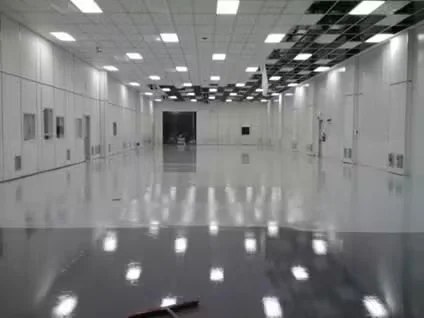 ESD floor system installed in a clean industrial room with reflective epoxy flooring and overhead lighting.