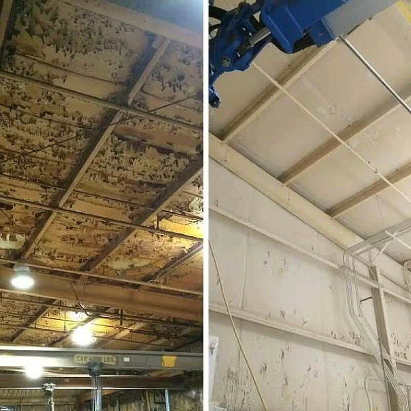 Split-screen “before and after” photo of an industrial facility ceiling—left side shows heavy rust, peeling paint, and corrosion across metal panels and beams; right side shows the same ceiling cleaned and repainted a uniform light color, with the structure looking brighter and restored.