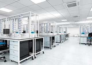 Pharmaceutical industry modern laboratory with lab benches, storage, and computers.