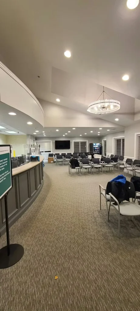 Renovated medical clinic waiting room with new lighting, seating layout, and refreshed interior finishes.
