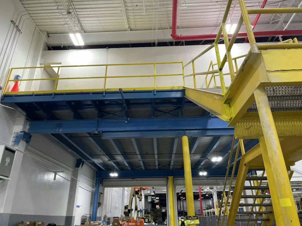 High-bay industrial ceiling with lighting upgrades during plant renovation