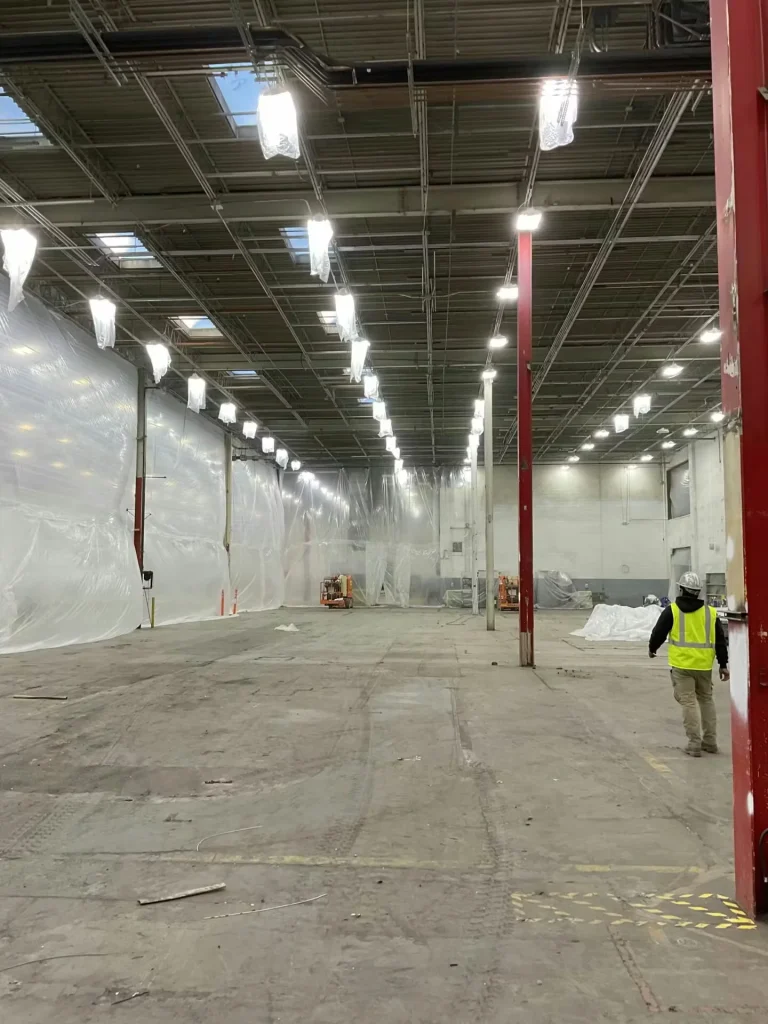 Industrial facility ceiling after revitalization with new lighting and piping
