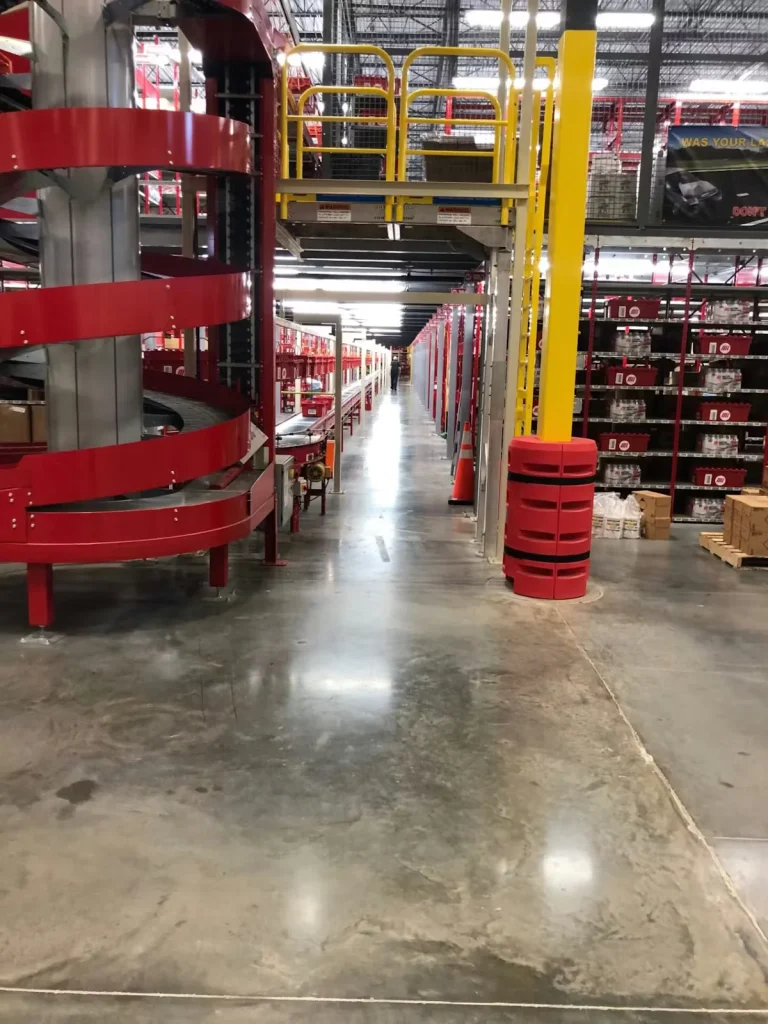 Industrial warehouse interior with safety walkways, guardrails, and conveyor system