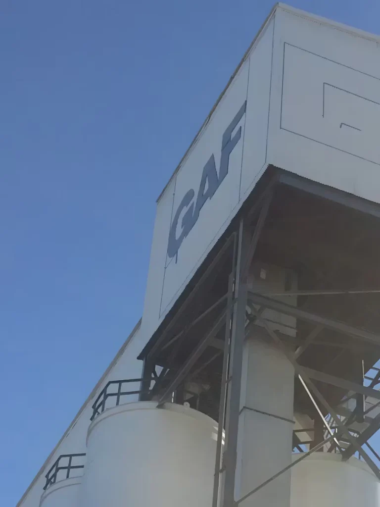 Industrial silo headhouse structure with painted exterior panels at a grain facility